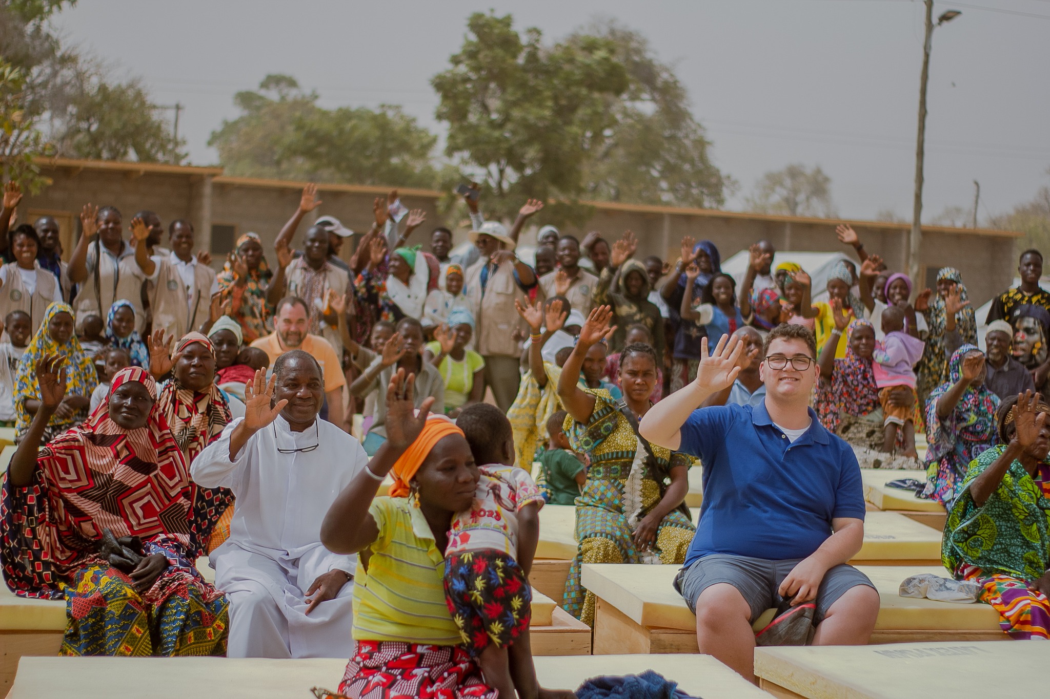Joseph and crowd waving