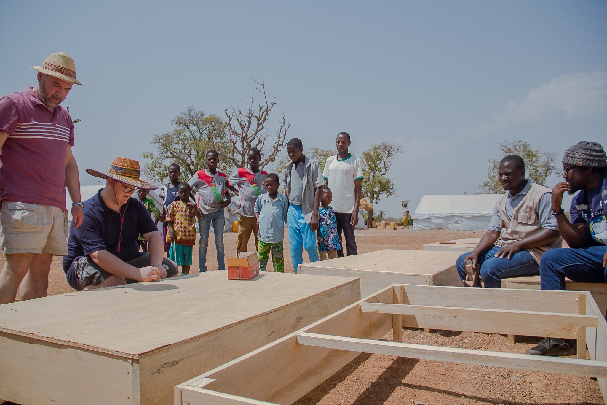 Joseph and his dad helping to nail some wood