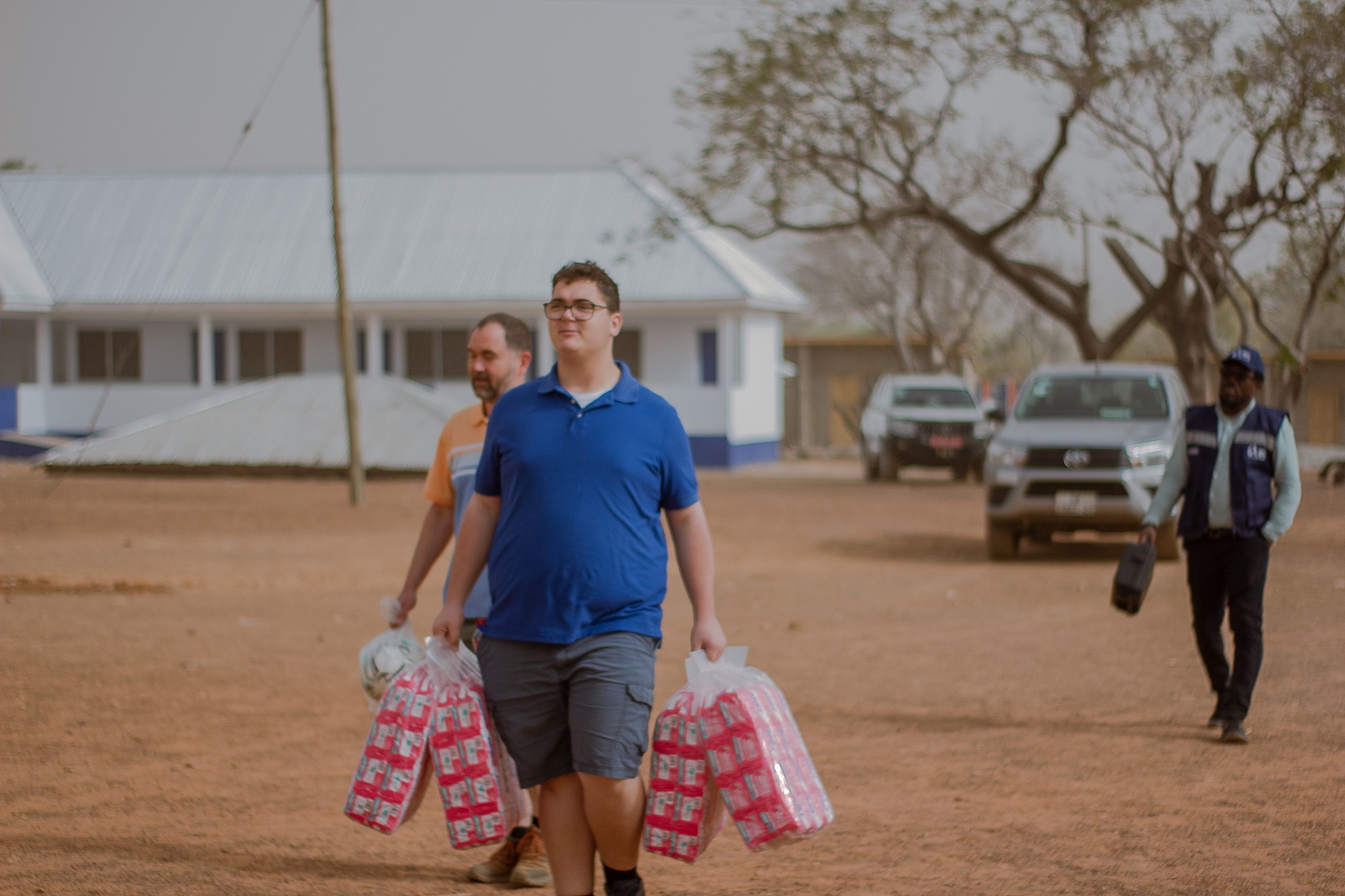 Joseph helping to carry items