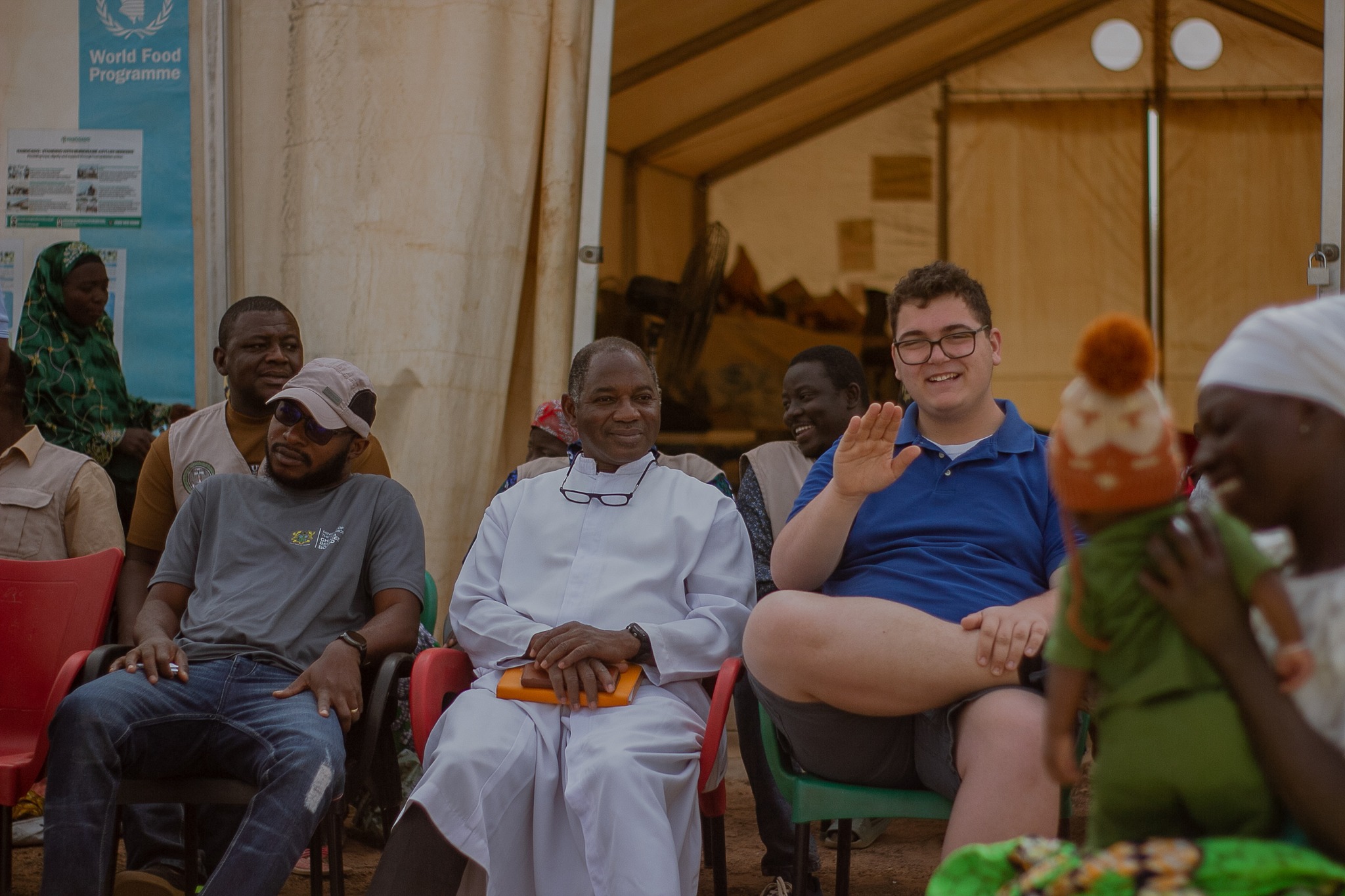 Joseph waves for a picture